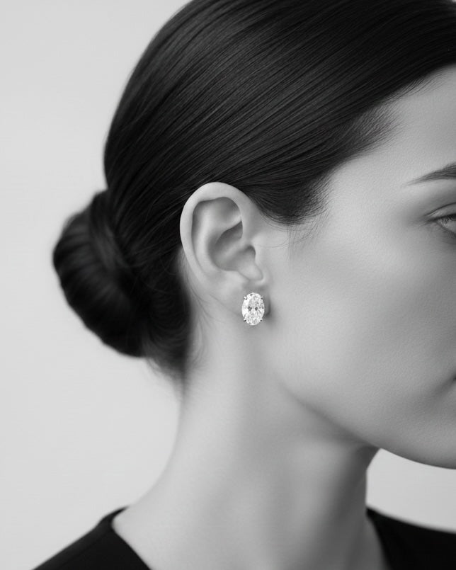 facetsn close-up side profile wearing oval lab-grown diamond stud earring in black and white