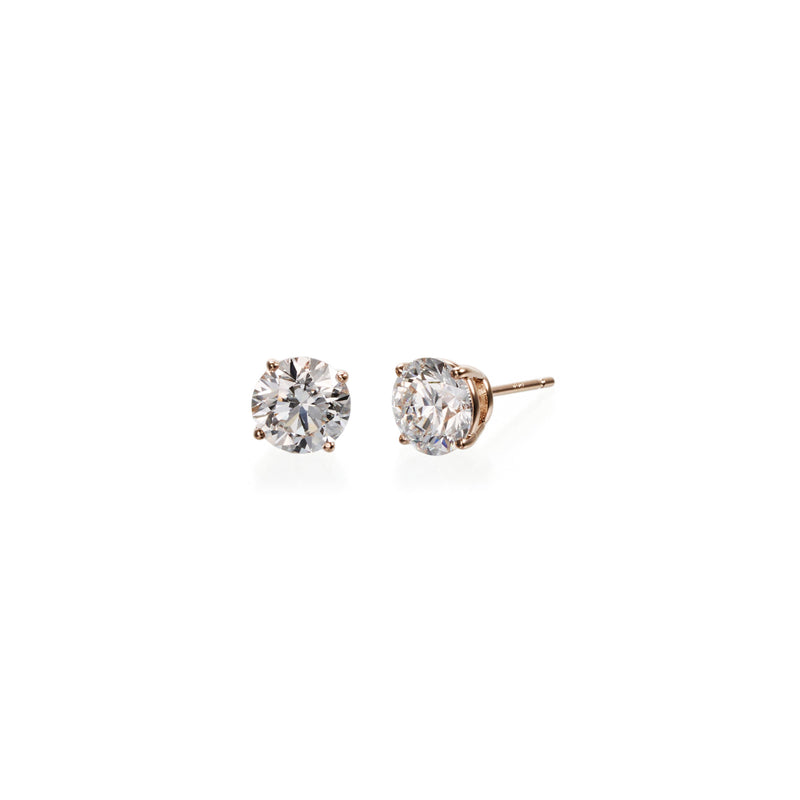 Side view: Round brilliant lab diamond stud earrings in 18k pink gold with four-prong basket setting, side profile view